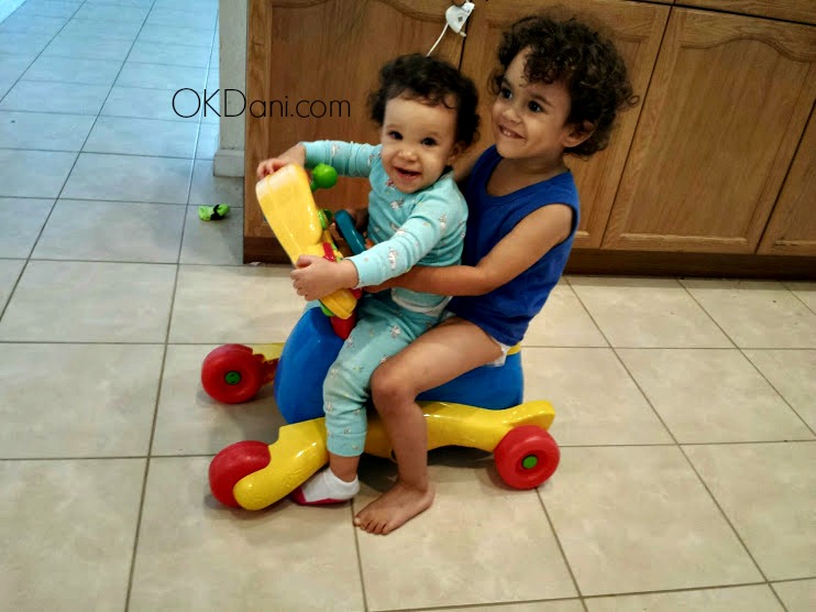curly kids on riding toy